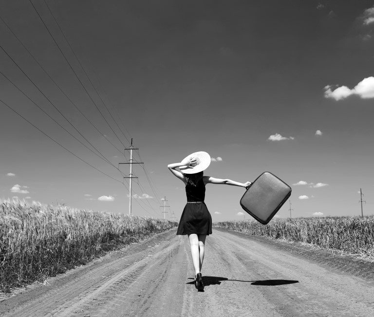 Lonely,Girl,With,Suitcase,At,Country,Road.,Photo,In,Black