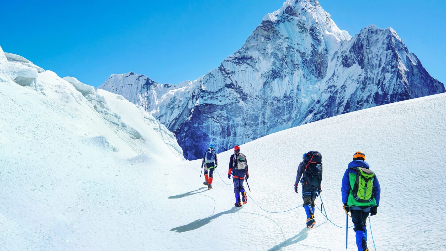 Group,Of,Climbers,Reaches,The,Summit,Of,Mountain,Peak,Enjoying