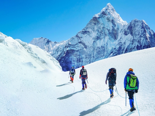 Group,Of,Climbers,Reaches,The,Summit,Of,Mountain,Peak,Enjoying