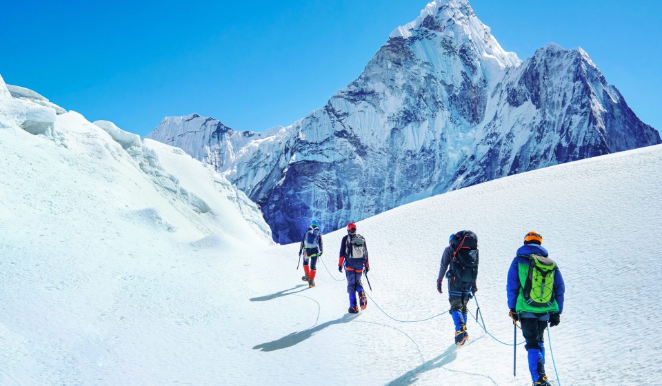 Group,Of,Climbers,Reaches,The,Summit,Of,Mountain,Peak,Enjoying