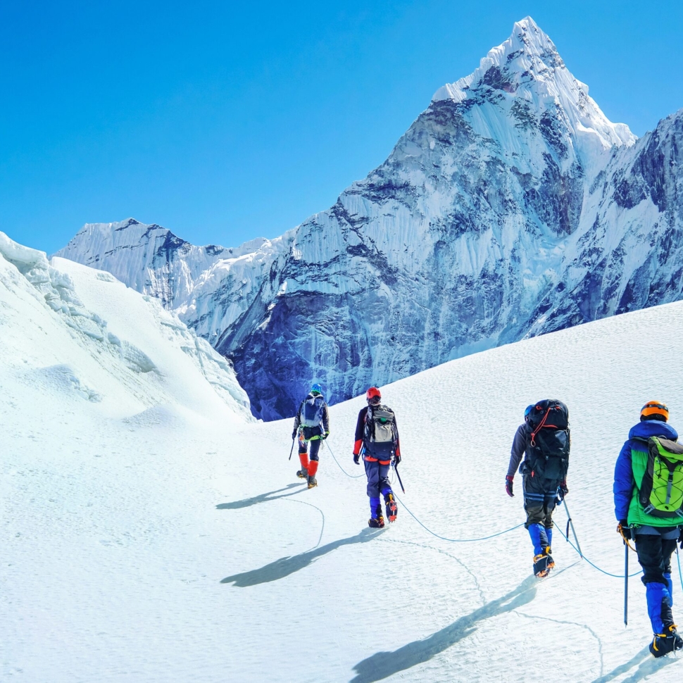 Group,Of,Climbers,Reaches,The,Summit,Of,Mountain,Peak,Enjoying